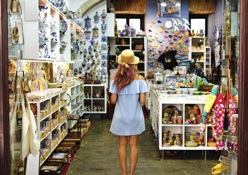 Blonde woman in souvenir shop in Lisbon, Portugal